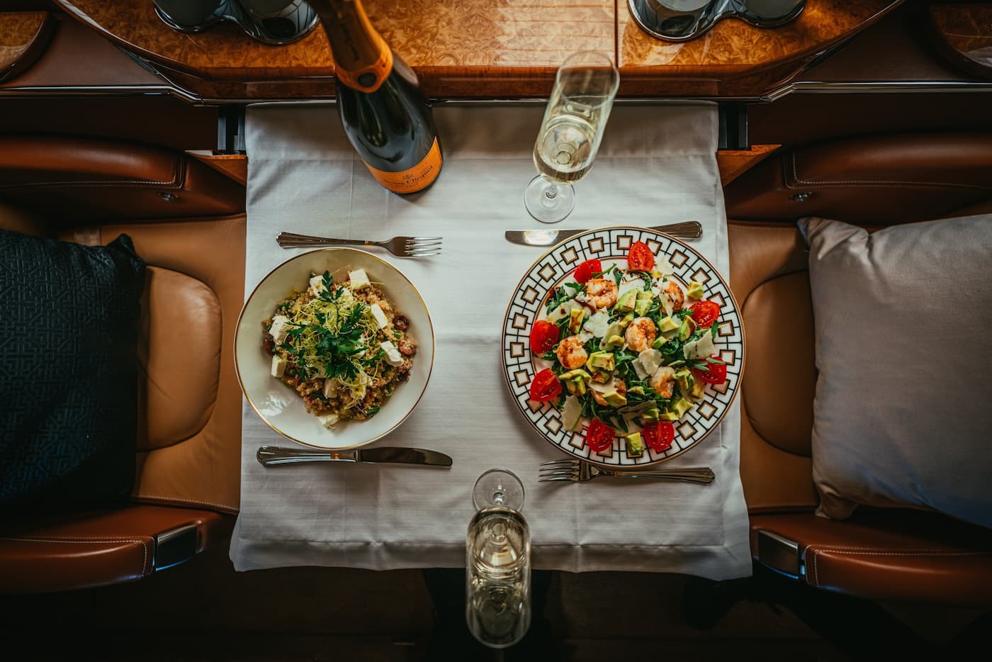 Table set for two in a jet cabin, seen from above